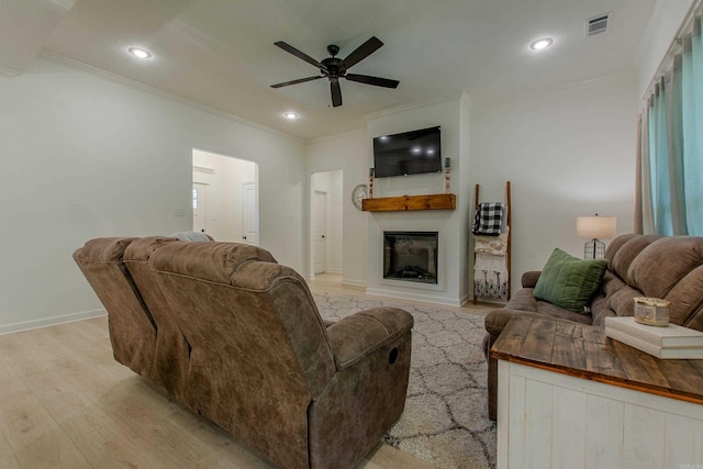 18508 Parkway Pines Dr, Bauxite, AR 72011 - living area with ornamental molding, light wood-style floors, ceiling fan, a fireplace, and recessed lighting
