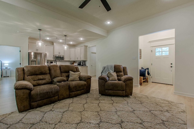 18508 Parkway Pines Dr, Bauxite, AR 72011 - living area featuring crown molding, a ceiling fan, light wood-style flooring, and recessed lighting