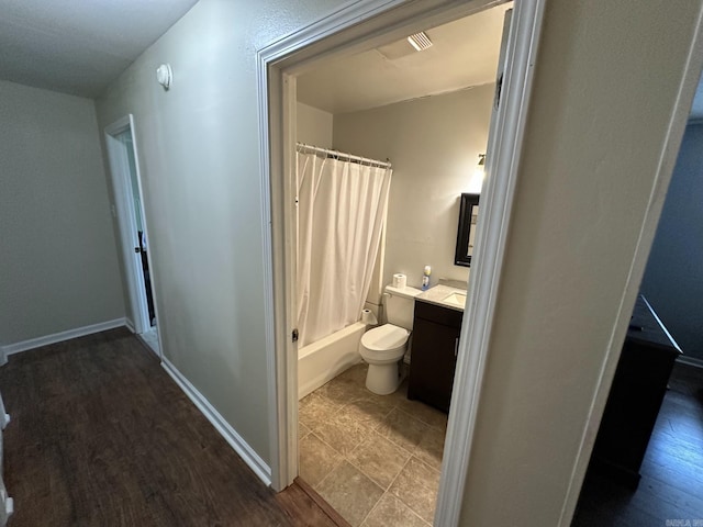 207 Byron St, Beebe, AR 72012 - full bath featuring vanity, shower / tub combo, and wood finished floors