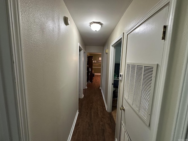 207 Byron St, Beebe, AR 72012 - hallway with dark wood finished floors and baseboards