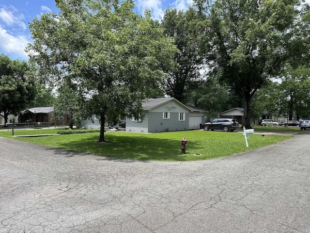 207 Byron St, Beebe, AR 72012 - view of front of home with a front yard and a garage