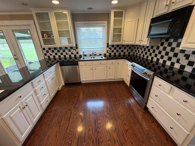 2025 Fairway St, Stuttgart, AR 72160 - kitchen featuring appliances with stainless steel finishes, dark countertops, ornamental molding, recessed lighting, and decorative backsplash