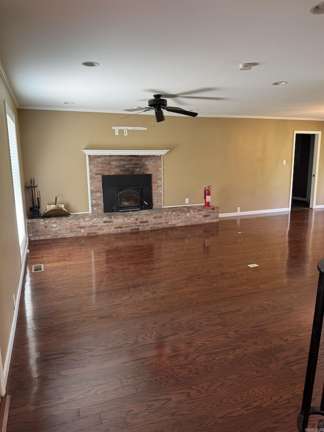 2025 Fairway St, Stuttgart, AR 72160 - unfurnished living room featuring ceiling fan, crown molding, and wood finished floors