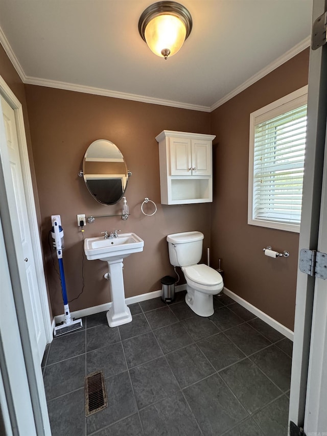 2025 Fairway St, Stuttgart, AR 72160 - bathroom with ornamental molding and tile patterned floors