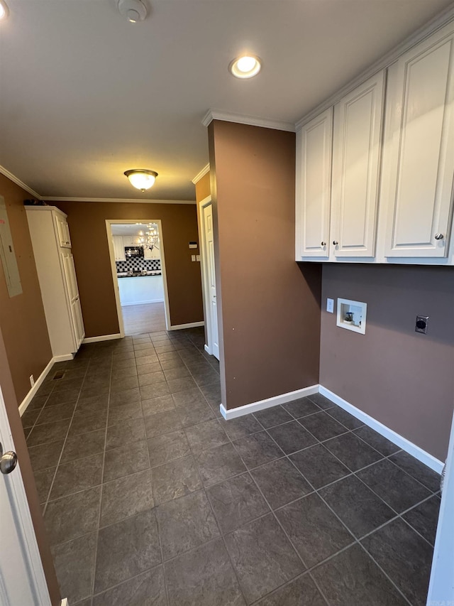2025 Fairway St, Stuttgart, AR 72160 - laundry area featuring ornamental molding, washer hookup, cabinet space, dark tile patterned flooring, and hookup for an electric dryer