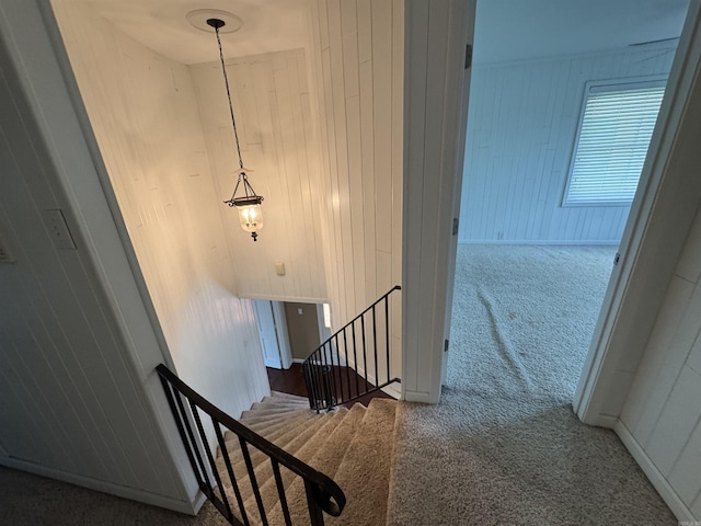 2025 Fairway St, Stuttgart, AR 72160 - stairway featuring carpet and wood walls