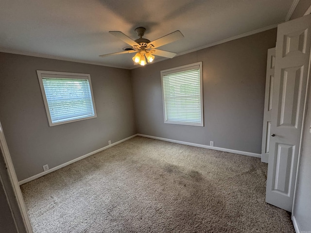 2025 Fairway St, Stuttgart, AR 72160 - spare room featuring crown molding, ceiling fan, and carpet flooring