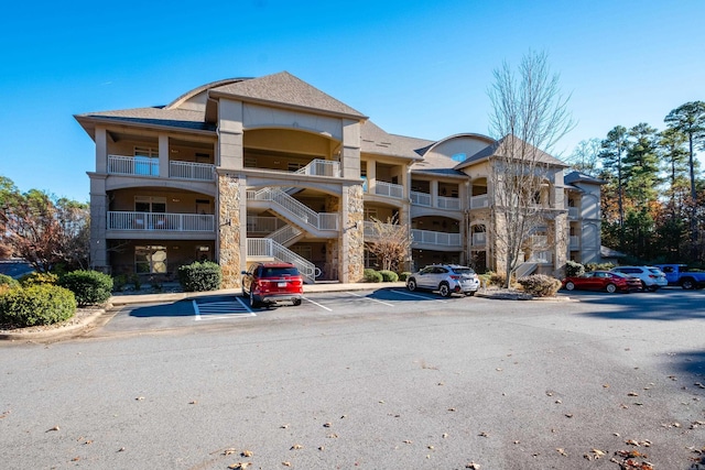 100 Vallon Ln, Little Rock, AR 72223 - view of apartment building / complex featuring uncovered parking