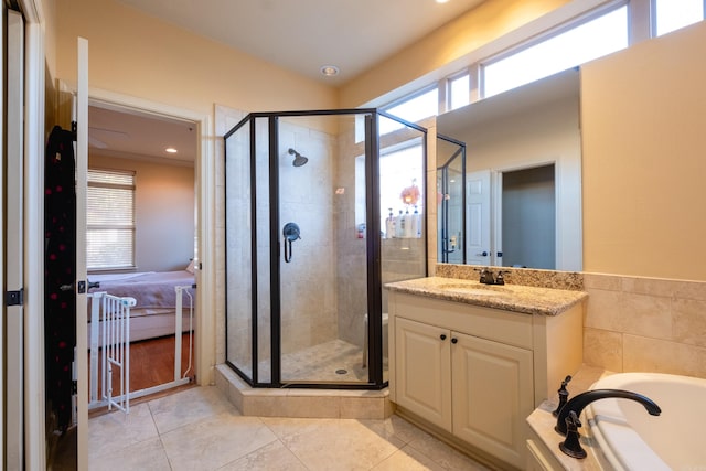 100 Vallon Ln, Little Rock, AR 72223 - full bathroom with healthy amount of natural light, a stall shower, vanity, and tile patterned flooring