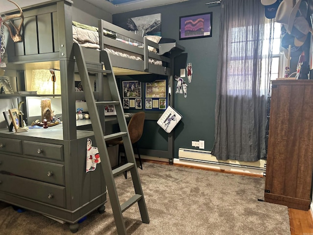 102 Mockingbird Ln, Arkadelphia, AR 71923 - bedroom with baseboard heating and wood finished floors