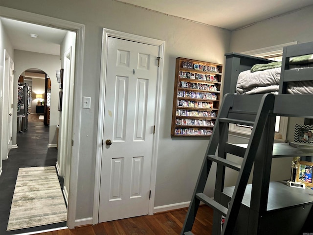 102 Mockingbird Ln, Arkadelphia, AR 71923 - bedroom with arched walkways and dark wood-type flooring