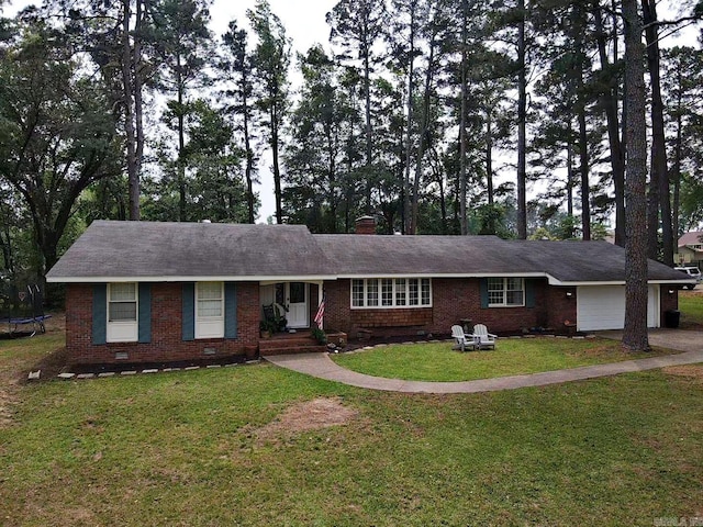 102 Mockingbird Ln, Arkadelphia, AR 71923 - ranch-style home featuring a trampoline, a garage, a front lawn, brick siding, and a chimney