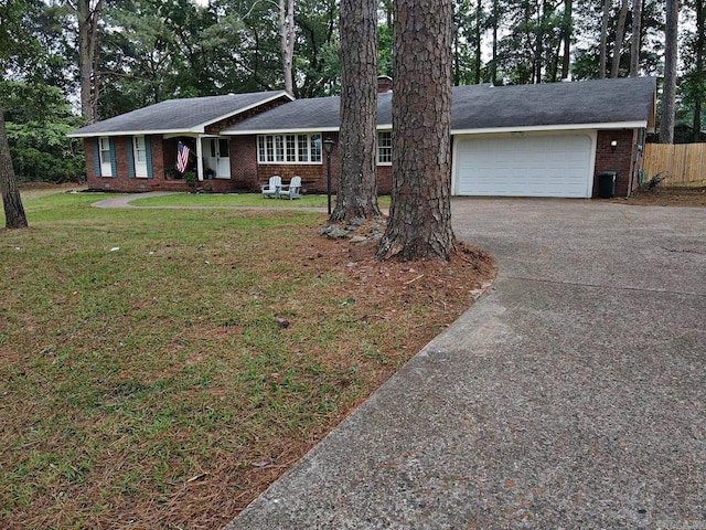 102 Mockingbird Ln, Arkadelphia, AR 71923 - ranch-style home with asphalt driveway, an attached garage, and brick siding