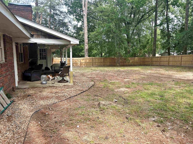 102 Mockingbird Ln, Arkadelphia, AR 71923 - fenced backyard featuring a patio area and view of scattered trees