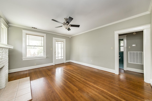 4106 C St, Little Rock, AR 72205 - unfurnished living room featuring wood finished floors, a fireplace, a ceiling fan, and crown molding