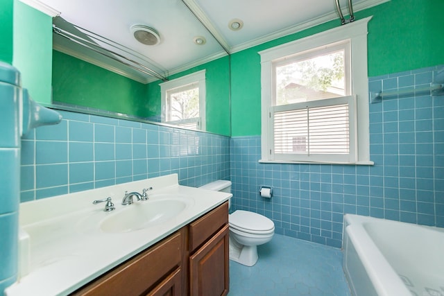 4106 C St, Little Rock, AR 72205 - bathroom featuring tile walls, a bath, ornamental molding, vanity, and tile patterned floors