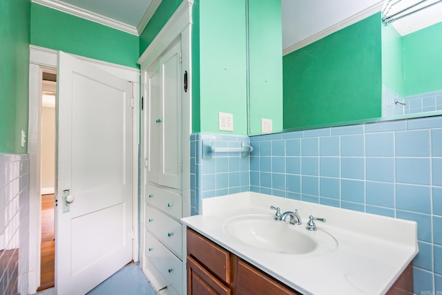 4106 C St, Little Rock, AR 72205 - bathroom with tile walls, ornamental molding, vanity, and wainscoting
