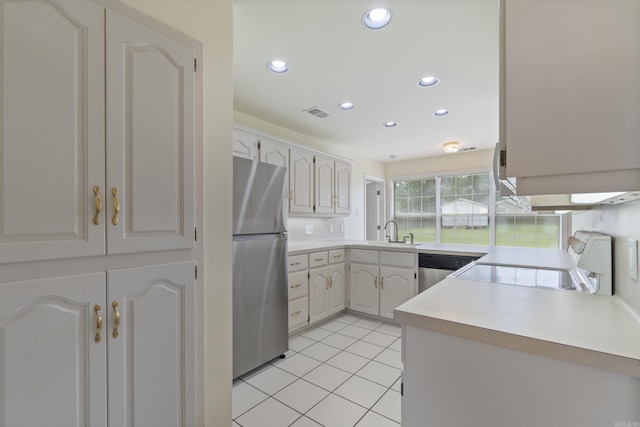 kitchen featuring appliances with stainless steel finishes, recessed lighting, light countertops, and light tile patterned floors