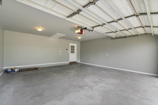 garage featuring a garage door opener and baseboards