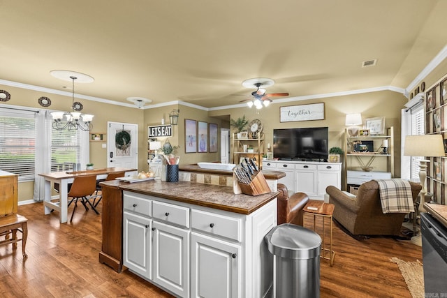 27 Magnolia Ln, Ward, AR 72176 - kitchen with dark countertops, ceiling fan, white cabinets, a center island, and dark wood finished floors