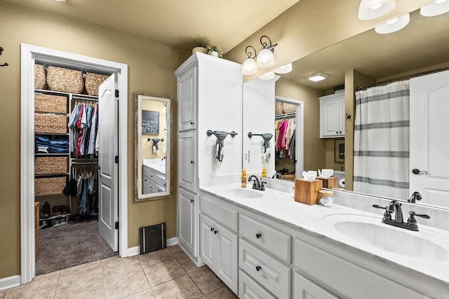 27 Magnolia Ln, Ward, AR 72176 - full bathroom with double vanity, a spacious closet, tile patterned floors, and curtained shower