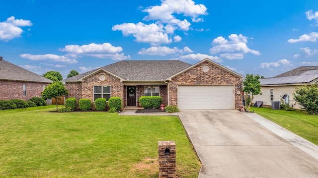 27 Magnolia Ln, Ward, AR 72176 - traditional-style home with brick siding, an attached garage, and a front yard
