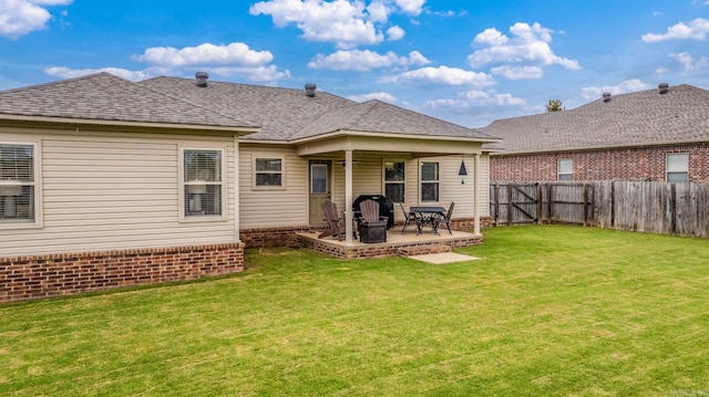 27 Magnolia Ln, Ward, AR 72176 - rear view of property featuring a fenced backyard, a patio, brick siding, and a shingled roof