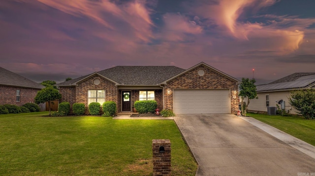 27 Magnolia Ln, Ward, AR 72176 - view of front of home with a garage, a yard, brick siding, driveway, and a shingled roof