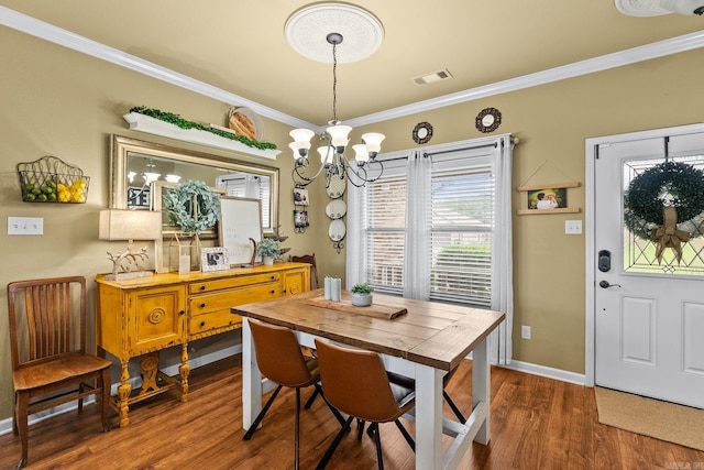 27 Magnolia Ln, Ward, AR 72176 - dining room featuring a chandelier, dark wood-type flooring, and ornamental molding