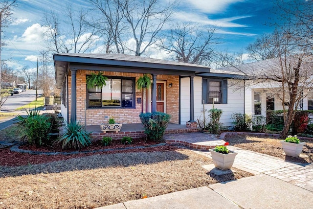 1101 W Charles Bussey Ave, Little Rock, AR 72206 - view of front of property with covered porch and brick siding