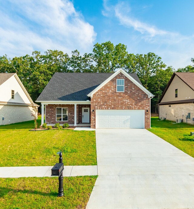 traditional home with brick siding, a front yard, driveway, and roof with shingles