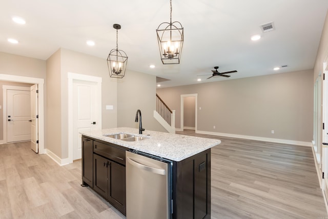 kitchen with stainless steel dishwasher, ceiling fan, light wood-type flooring, an island with sink, and recessed lighting