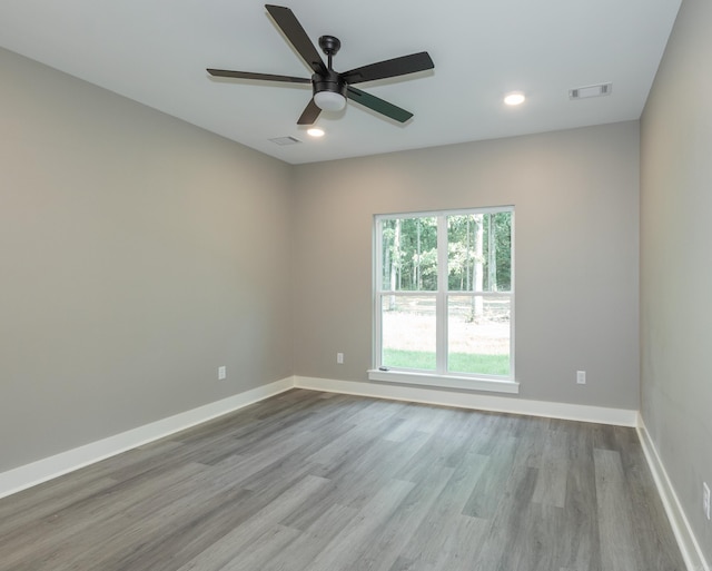 unfurnished room with wood finished floors, ceiling fan, and recessed lighting