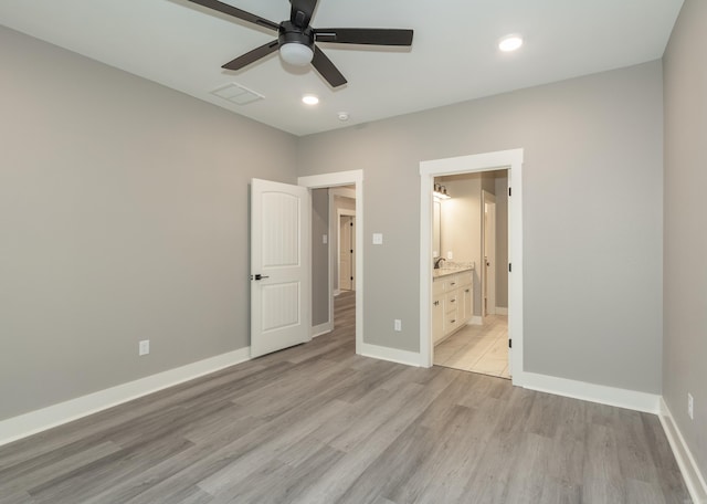 unfurnished bedroom with light wood-style floors, recessed lighting, ensuite bath, and a ceiling fan