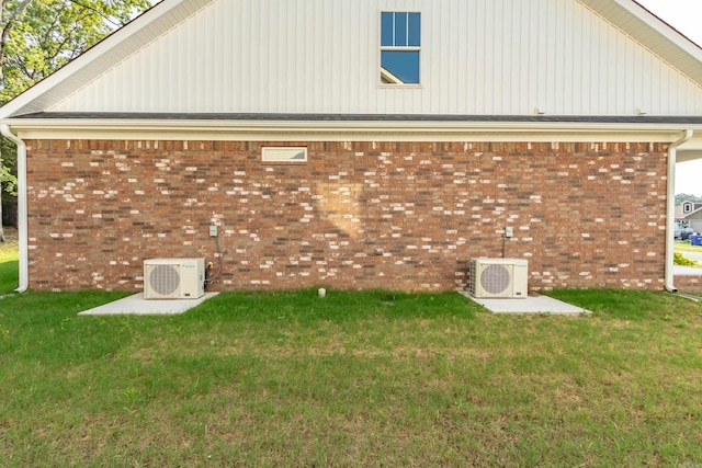 view of property exterior featuring a yard and brick siding