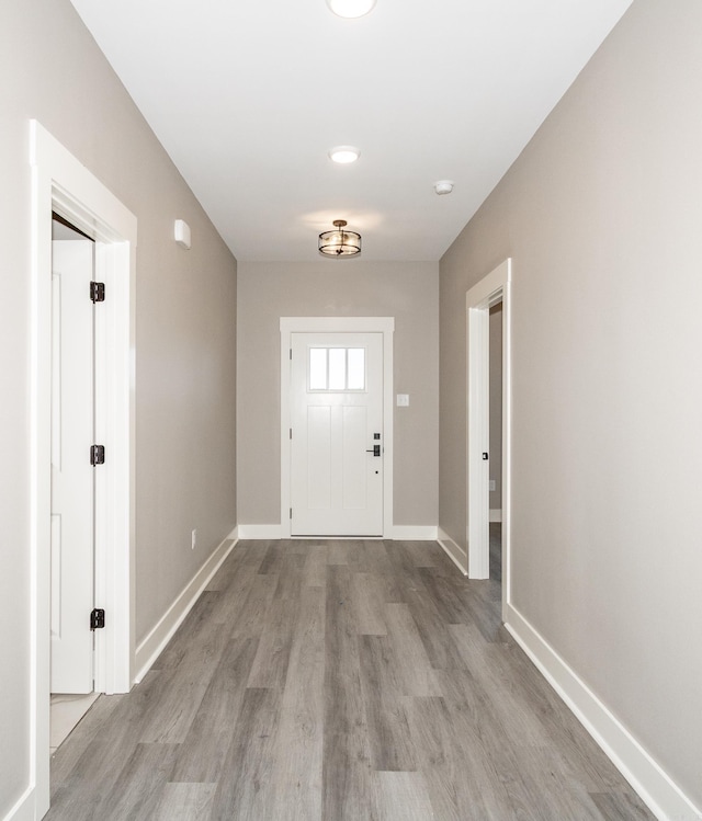 entryway with light wood-style floors and baseboards
