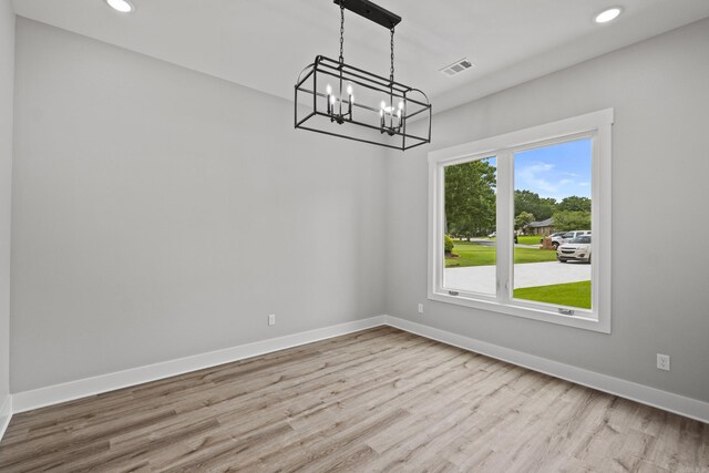 1500 Haley Ln, Conway, AR 72034 - unfurnished dining area with a chandelier, wood finished floors, and recessed lighting