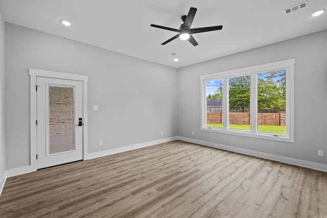 1500 Haley Ln, Conway, AR 72034 - spare room with wood finished floors, a ceiling fan, and recessed lighting