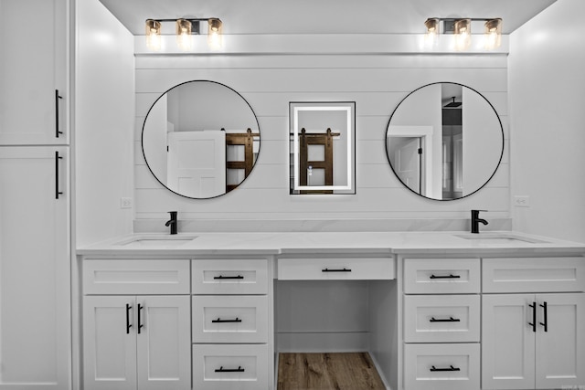 1500 Haley Ln, Conway, AR 72034 - full bathroom with double vanity and wood finished floors