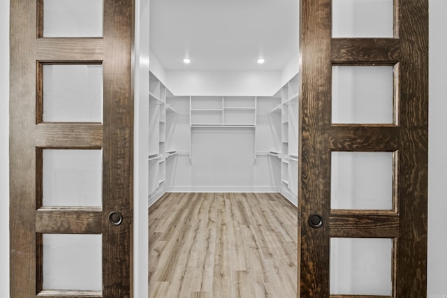 1500 Haley Ln, Conway, AR 72034 - walk in closet with wood finished floors