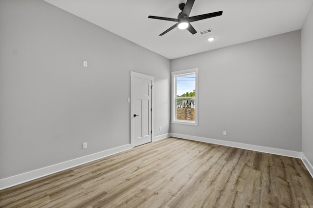 1500 Haley Ln, Conway, AR 72034 - spare room featuring wood finished floors, a ceiling fan, and recessed lighting