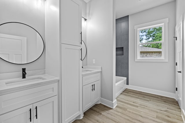 1500 Haley Ln, Conway, AR 72034 - full bathroom featuring vanity, wood finished floors, and  shower combination
