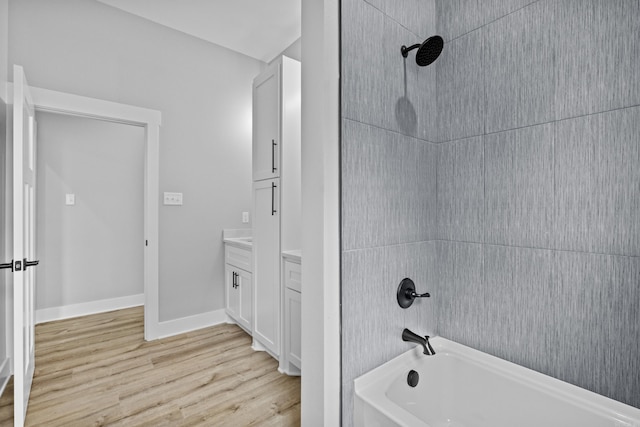 1500 Haley Ln, Conway, AR 72034 - full bathroom with washtub / shower combination, wood finished floors, and vanity