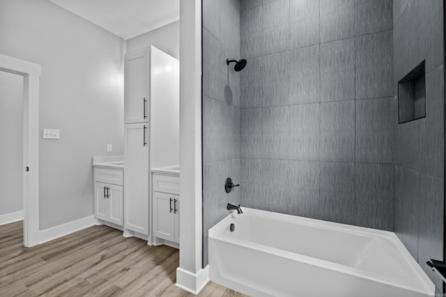 1500 Haley Ln, Conway, AR 72034 - full bath featuring wood finished floors, tub / shower combination, and vanity