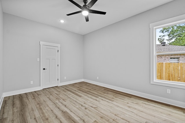 1500 Haley Ln, Conway, AR 72034 - spare room featuring wood finished floors, ceiling fan, and recessed lighting