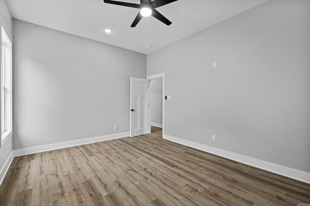 1500 Haley Ln, Conway, AR 72034 - empty room with ceiling fan, wood finished floors, and recessed lighting