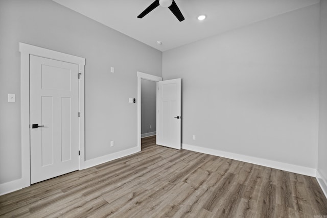 1500 Haley Ln, Conway, AR 72034 - unfurnished bedroom featuring wood finished floors, ceiling fan, and recessed lighting