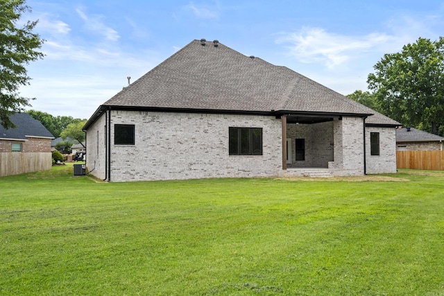 1500 Haley Ln, Conway, AR 72034 - back of house featuring a shingled roof and brick siding