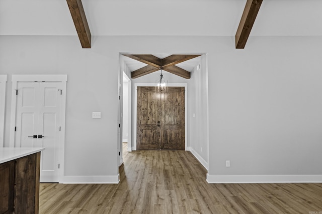 1500 Haley Ln, Conway, AR 72034 - foyer entrance featuring beam ceiling and light wood finished floors