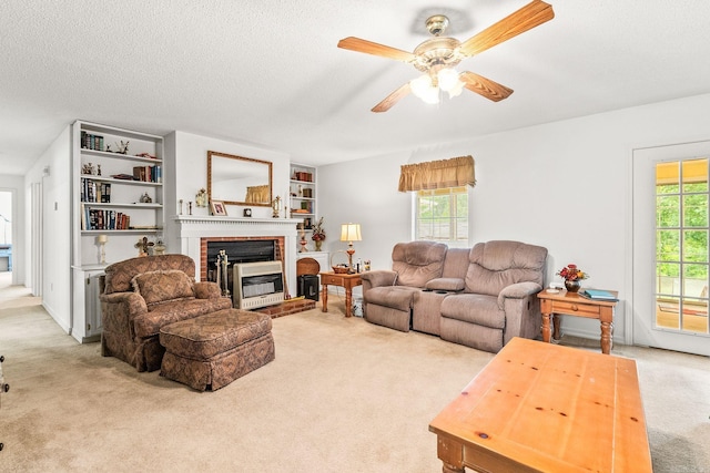 114 Woodiel Cir, Cabot, AR 72023 - living room with carpet, ceiling fan, a brick fireplace, and a textured ceiling